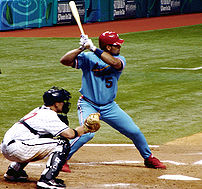 Albert Pujols at bat, wearing a 1982 retro jer...